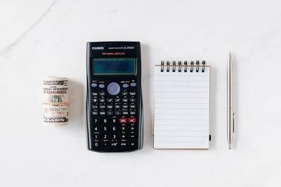 calculator money and notepad